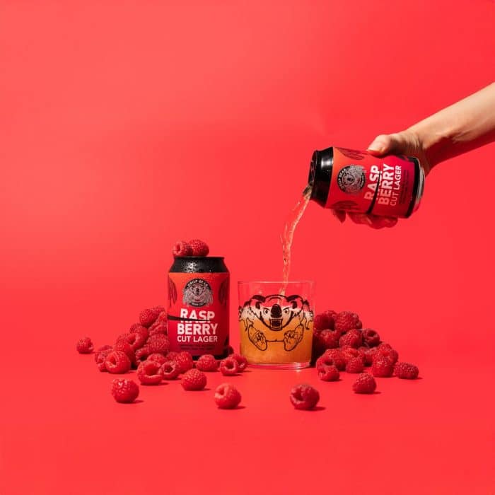 Raspberry Lager being poured into Drop Bear Glass