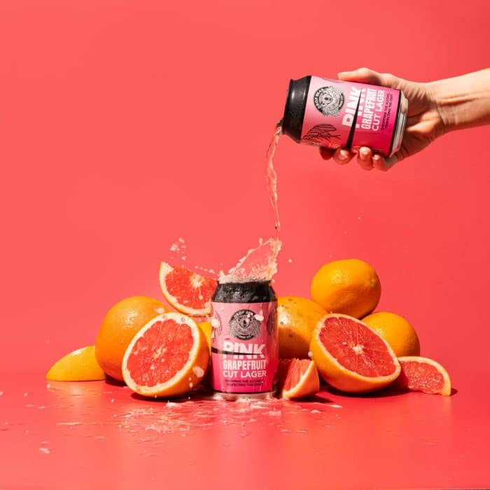 Pink Grapefruit Lager by Drop Bear being poured over Grapefruit Cut Lager